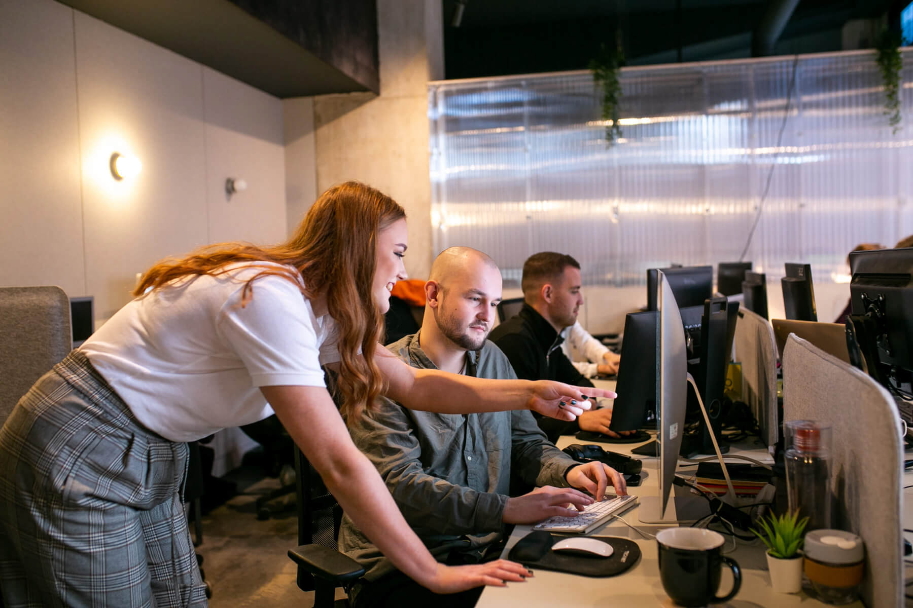 office workers looking at screen 