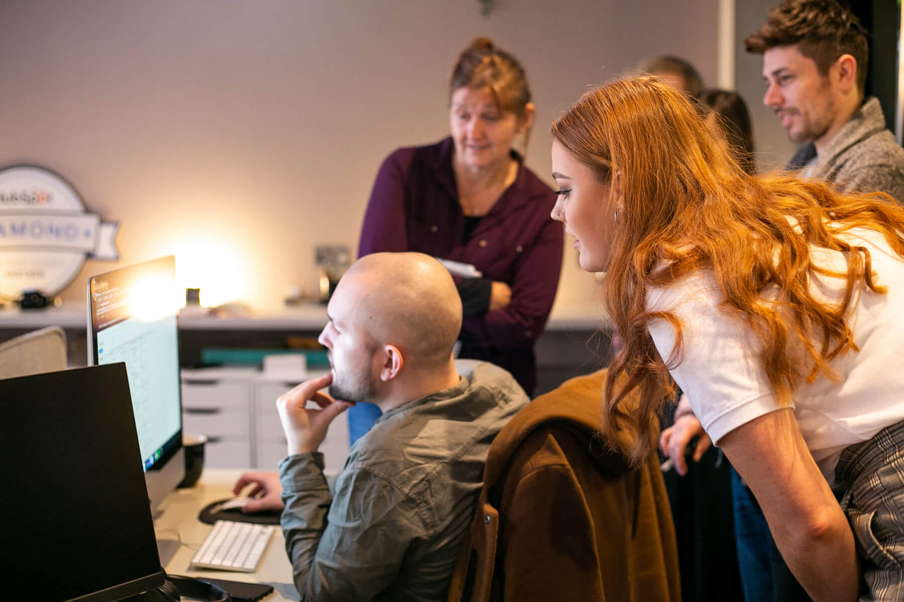 group looking at computer